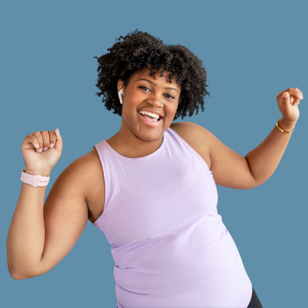 Confident woman looks happy with her hands raised